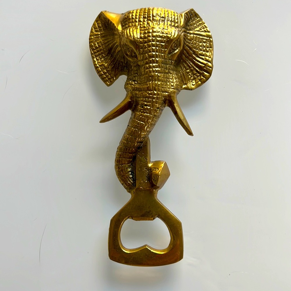 Vintage elephant bottle opener. Gold metal.